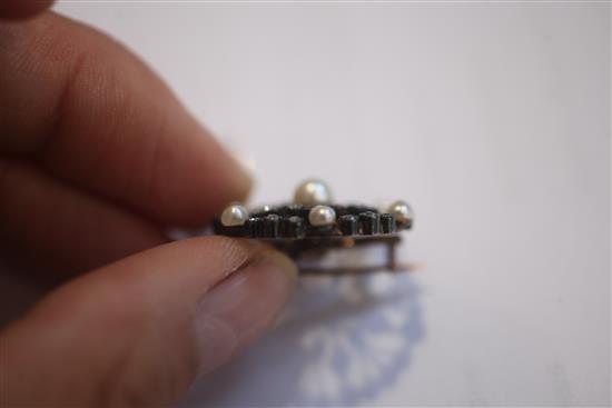 An early 20th century gold and silver, diamond and cultured pearl set openwork circular pendant brooch, 1.25in.